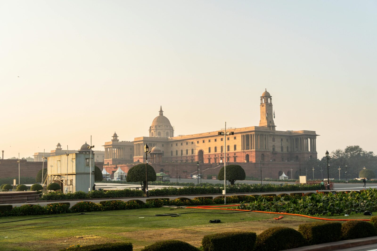 Stunning view of Rashtrapati Bhavan with a clear sky in New Delhi, India, during sunrise.